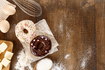 Donuts with ingredients for their preparation