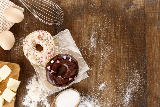 Donuts with ingredients for their preparation