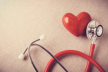 red heart with stethoscope, heart health,  health insurance concept