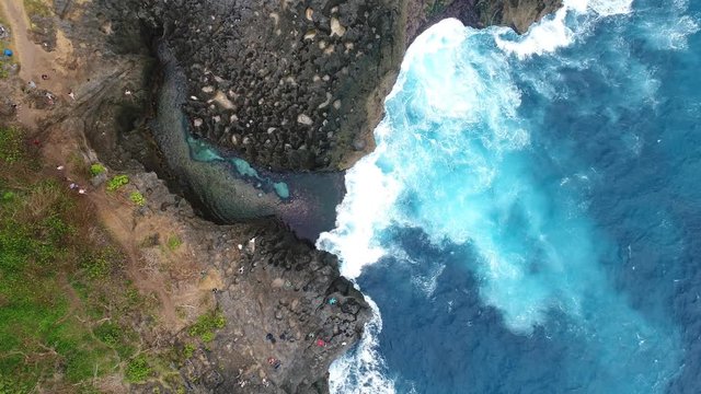 Aerial view by drone 4k camera. Angel's Billabong beach. Nusa Penida, Indonesia. Bird eye view. zoom in