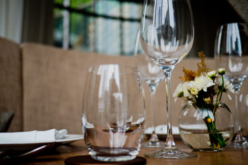 Empty glasses wine in restaurant. Glass water.dish spoon fork on table at restaurant