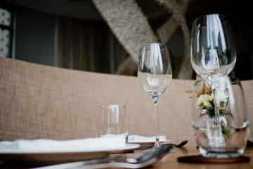 Empty glasses wine in restaurant. Glass water.dish spoon fork on table at restaurant