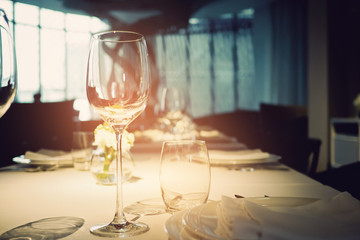 Empty glasses wine in restaurant. Glass water.dish spoon fork on table at restaurant