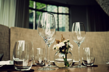 Empty glasses wine in restaurant. Glass water.dish spoon fork on table at restaurant