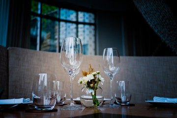 Empty glasses wine in restaurant. Glass water.dish spoon fork on table at restaurant