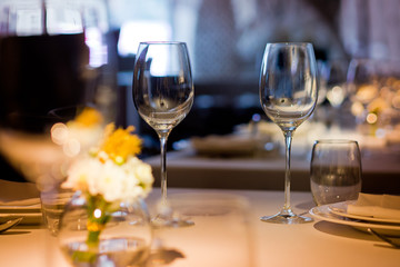 Empty glasses wine in restaurant. Glass water.dish spoon fork on table at restaurant