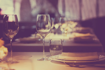 Empty glasses wine in restaurant. Glass water.dish spoon fork on table at restaurant