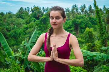 Woman hands in Namaste prayer mudra. Symbolic gesture in Hinduism, Buddhism