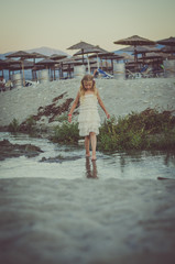 child in resort by the sea