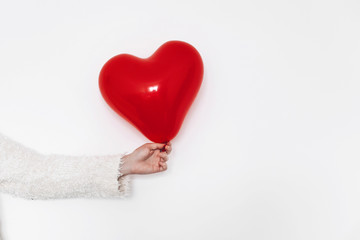 Fototapeta premium red heart in hand, isolated on white. happy valentine's day concept. healthcare, medicine and blood donation donor concept. love and protection . space for text.