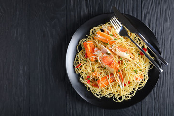 spaghetti with Crab on black plate