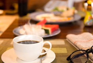 Breakfast with coffee and the newspaper