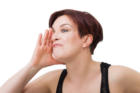 Beautiful woman portrait with short red hair mocking somebody while gesturing