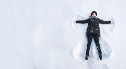 Girl in the snow angel shows . Winter angel