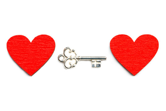 Old key with a heart  isolated on white background