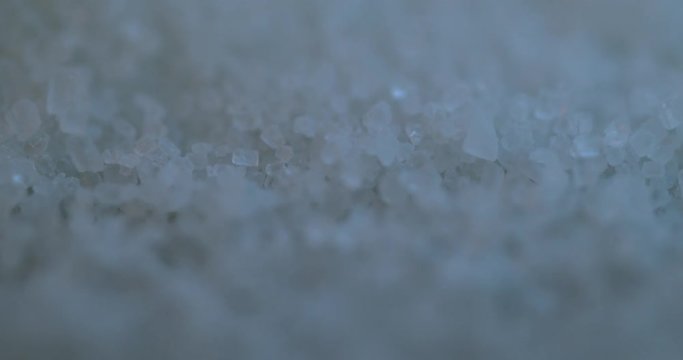 Falling sugar cane granules shot on high speed camera, phantom flex