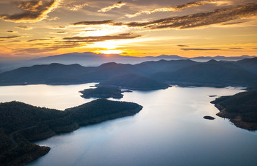 Aerial drone shot of sunset over the dam, Mae Kuang Dam at Chaing Mai province in THAILAND.