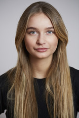 Fototapeta premium Young and beautiful woman looking to camera, studio