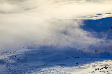 Obraz premium Mountains in fog. Morning lights. Fantastic winter scenery.