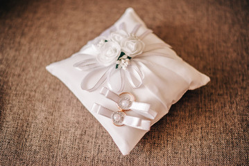 Wedding rings on the pillow