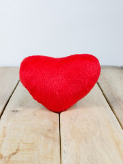 Decorative red heart on wooden table with copy space, Vintage filter, Valentine's day background, Sweet and romantic concept.