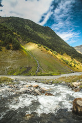 amazing waterfall, river, blue sky and clouds