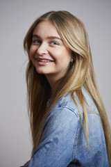 Fototapeta premium Smiling girl in denim shirt, portrait