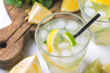 Italian lemon lime liqueur limoncello with ice and mint