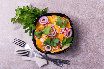 Italian Sicilian orange salad with onion, parsley. Copyspace, top view.