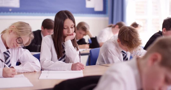 4k, A classroom full of students engrossed in their studies.