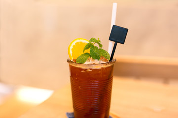 Iced tea with lemon and mint on the table