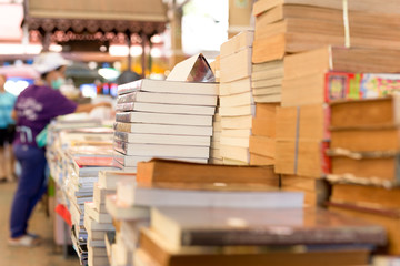 Piles of old books on a table