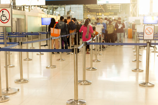 Passengers check-in line at the airport