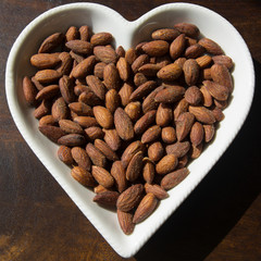 Roasted and Salted Almonds served in a heart shaped plate