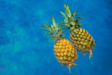 Two pineapples in pool