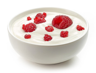 bowl of yogurt cream with raspberries