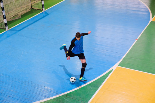 Football goalkeeper on goal, field, Futsal ball field in the gym indoor, Soccer sport field