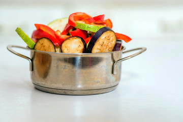 Fresh sliced vegetables in metal pan