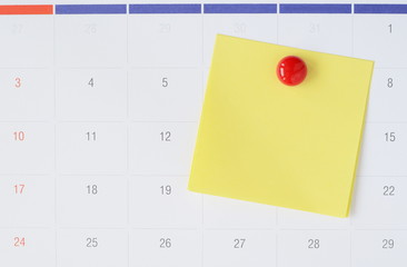 Paper notes on calendar with copy space for writing your task or new idea.
