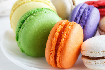 colorful cookies with bright dyes on a white plate