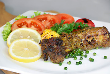 Close-up pork rip grill Steak with vagetables and French fries in white squre dish..