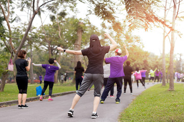 Group of people doing exercise aerobics dancing