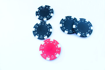 Poker chips on green background.