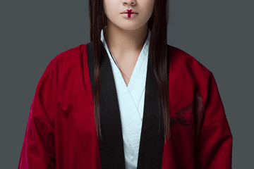 cropped shot of young asian woman with make up wearing kimono isolated on grey