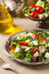 A delicious salad with sardines and feta cheese.