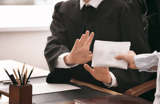 Judge refusing to take bribe from woman, closeup