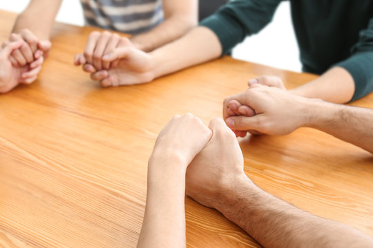 People holding hands together, closeup. Unity concept