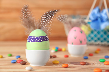 Decorated Easter egg on table, closeup