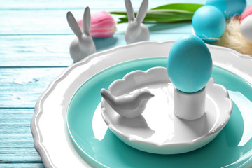 Beautiful festive Easter table setting with painted egg, closeup