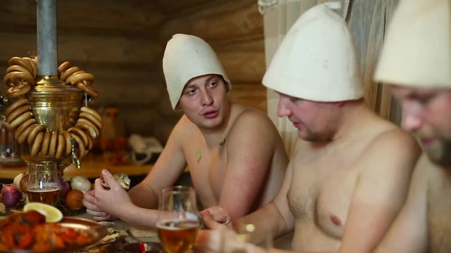 Men relaxing in the bathhouse